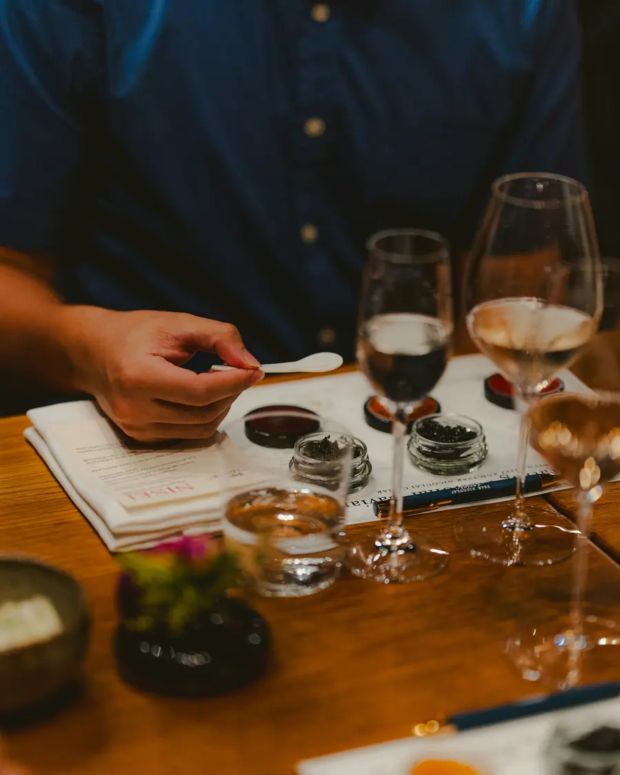 A guided tasting in progress: flight glasses, aroma jars and a tasting mat.